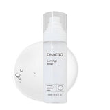 ProtoClinical k-beauty bravity DNAERO LumiAge Toner 100ml shown as a single light gray bottle upright and centered on a soft white background