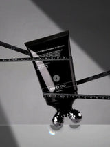 ProtoClinical k-beauty portrait beauty product packaging on a dark green background.