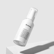 ProtoClinical k-beauty beige and brown beauty product packaging on a light background.