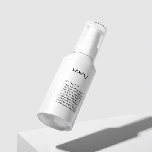ProtoClinical k-beauty beige and brown beauty product packaging on a light background.