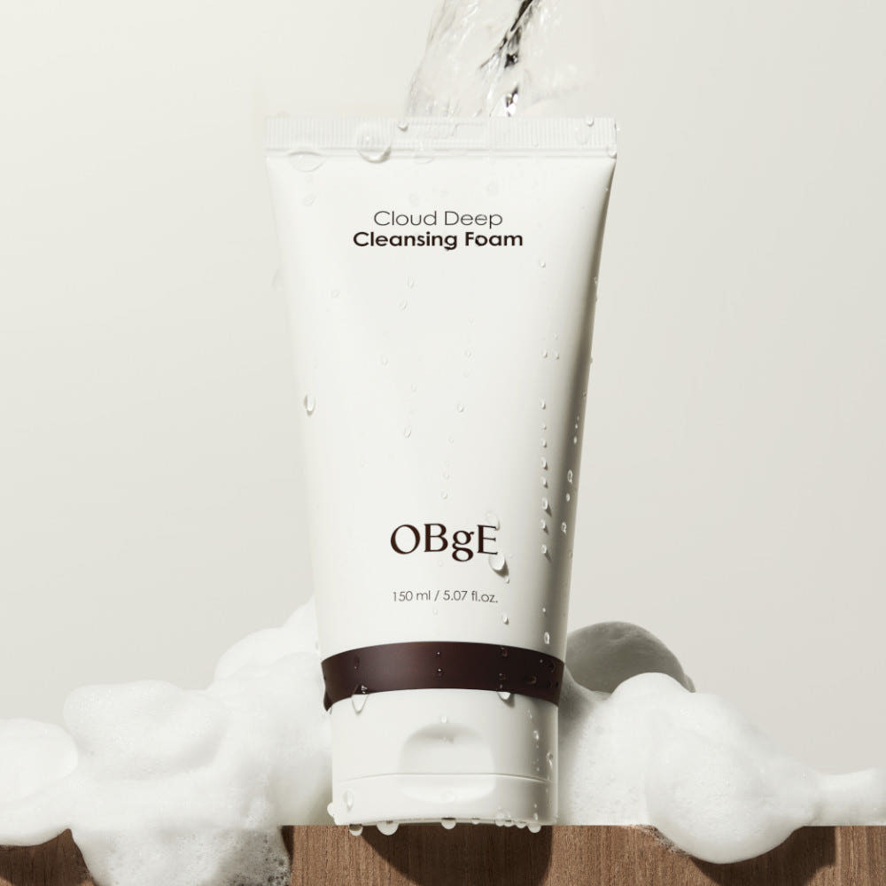 ProtoClinical k-beauty OBgE Cloud Deep Cleansing Foam 150ml upright white cleansing foam tube with a dark brown band, water droplets, and white foam on a light background
