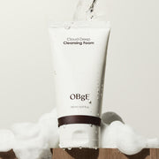 ProtoClinical k-beauty OBgE Cloud Deep Cleansing Foam 150ml upright white cleansing foam tube with a dark brown band, water droplets, and white foam on a light background