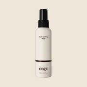 ProtoClinical k-beauty OBgE Style Setting Fixer 150ml single upright bottle silhouette centered on a soft cream background with pale beige side shading