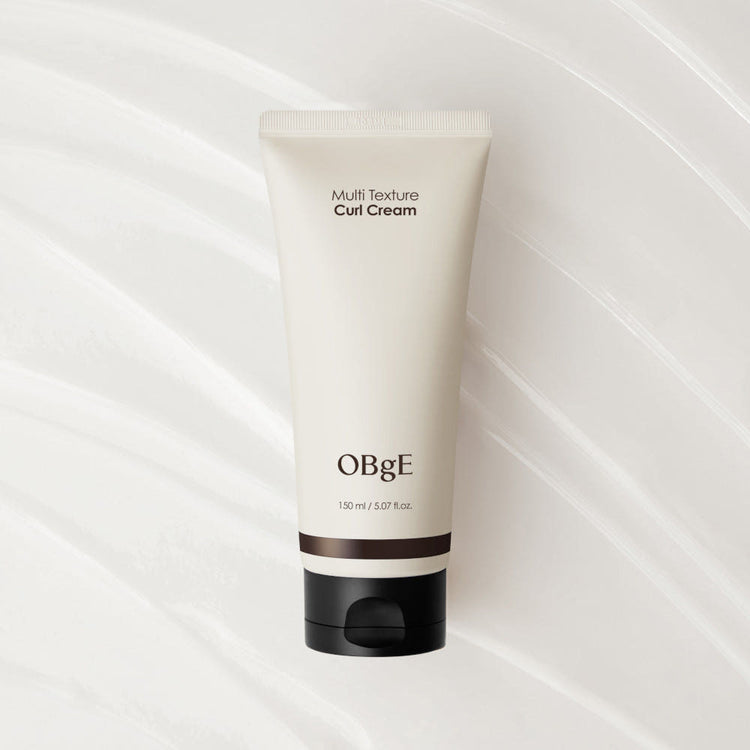 ProtoClinical k-beauty OBgE Multi Texture Curl Cream 150ml single upright light beige bottle centered on a pale background.