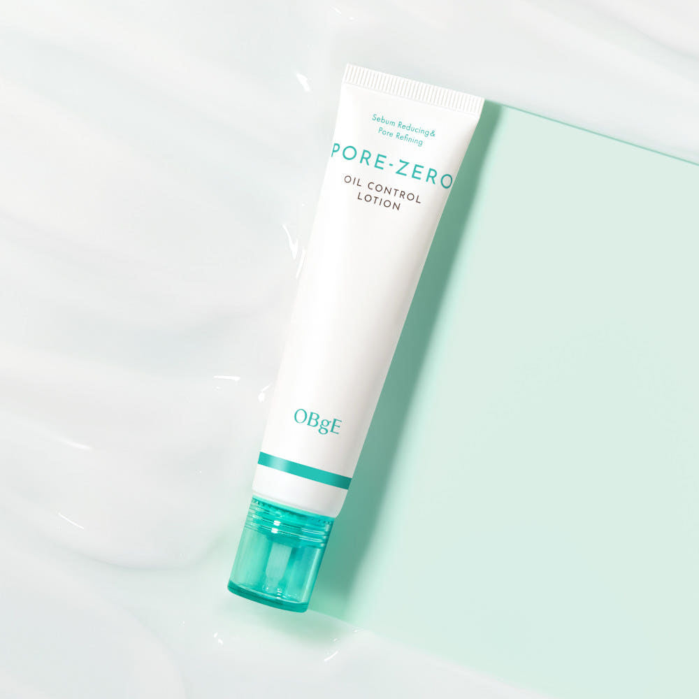 ProtoClinical k-beauty OBgE Pore Zero Oil Control Lotion 70ml single pale aqua lotion bottle with a darker gray base centered on a white background with soft pink side accents