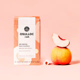 ProtoClinical k-beauty peach beauty product detail on a warm light background.