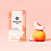 ProtoClinical k-beauty peach beauty product detail on a warm light background.