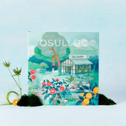 ProtoClinical k-beauty OSULLOC Tea Garden Gift Box Set (27 count, 9 flavors X 3ea) illustrated tea gift box standing upright with floral artwork on a pale blue background and citrus accents