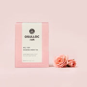 ProtoClinical k-beauty soft pink beauty product detail on a pale mauve background.
