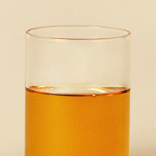 ProtoClinical k-beauty peach beauty product detail on a pale yellow background.