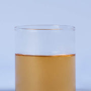 ProtoClinical k-beauty pale blue beauty product silhouette with a warm gold center on a light background.