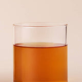 ProtoClinical k-beauty peach beauty detail with a bright orange lower form and pale aqua side accents.