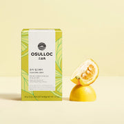 ProtoClinical k-beauty pale yellow beauty product detail with a soft peach edge on an off-white background.