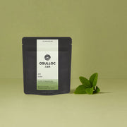 ProtoClinical k-beauty olive green beauty graphic with a faint grid pattern on a light background.