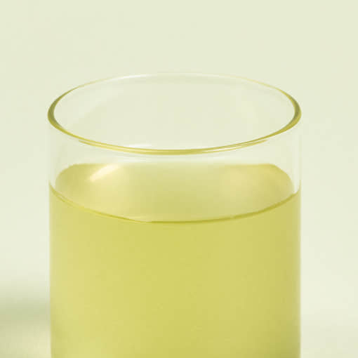 ProtoClinical k-beauty yellow-green beauty product detail on a light background.