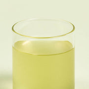 ProtoClinical k-beauty yellow-green beauty product detail on a light background.