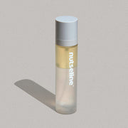 ProtoClinical k-beauty pale vertical beauty product silhouette with soft blue side accents on a light background.