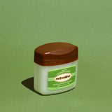 ProtoClinical k-beauty dark oval beauty compact on a soft green background.