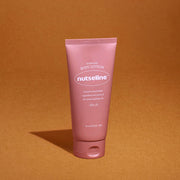 ProtoClinical k-beauty warm amber beauty graphic with a soft pink vertical center on a brown-orange background.