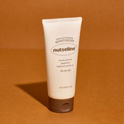 ProtoClinical k-beauty warm amber beauty product silhouette with a light cream center on a rich orange background.