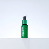 ProtoClinical k-beauty MEDIHEAL Teatree Trouble Calming Oil 10ml single upright green oil bottle centered on a pale lavender background
