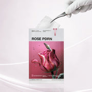 ProtoClinical k-beauty MEDIHEAL Rose PDRN Essential Mask Healthy Glow 24ml X 10ea single rose-pink sheet mask packet with tweezers lifting the translucent mask on a clean light background