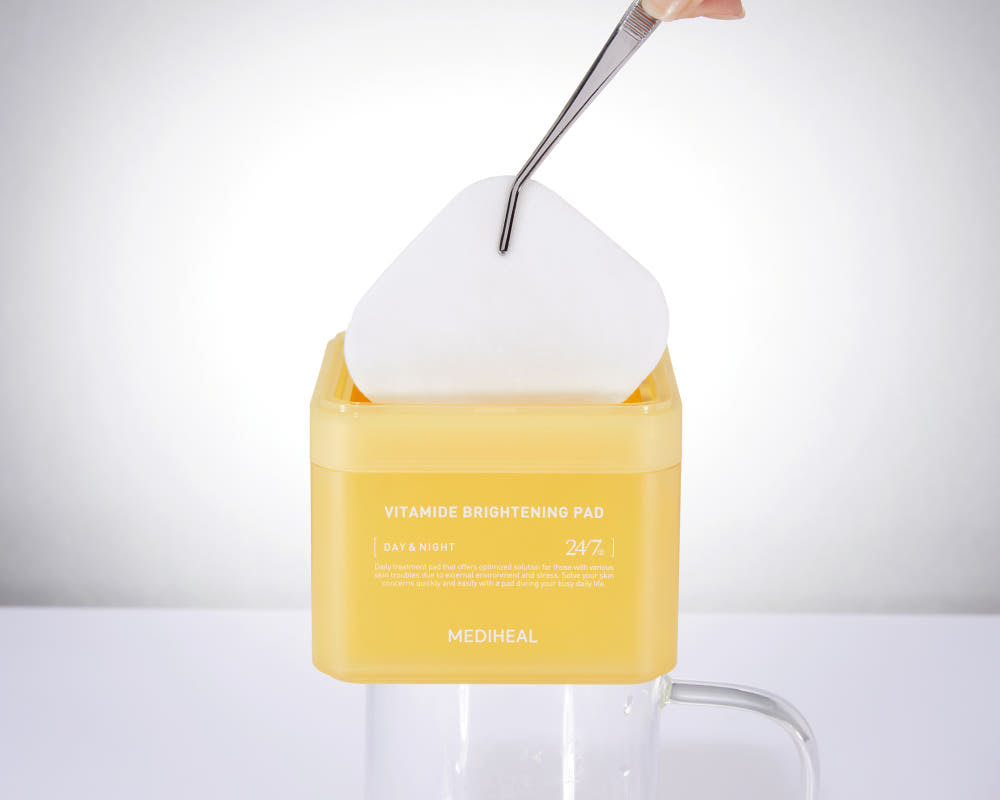 ProtoClinical k-beauty MEDIHEAL Vitamide Brightening Pad 180ml/100ea shown as a single yellow round toner pad jar