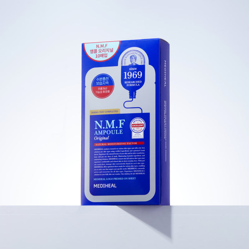 ProtoClinical k-beauty MEDIHEAL The N.M.F Ampoule Mask Original 27ml X 10ea upright blue box packaging on a light gray surface with a long shadow