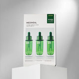 ProtoClinical k-beauty MEDIHEAL Teatree Ampoule Mask 25ml X 10ea shown with one green mask pouch beside a matching product box on a pale background