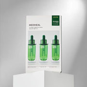 ProtoClinical k-beauty MEDIHEAL Teatree Ampoule Mask 25ml X 10ea shown with one green mask pouch beside a matching product box on a pale background