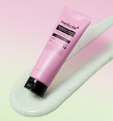 ProtoClinical k-beauty pink beauty graphic with a muted gray center and soft pale green lower accents on a light background.
