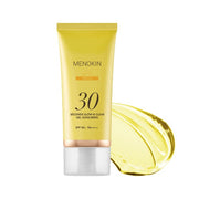 MENOKIN Glow & Clear Gel Sunscreen SPF50+ PA++++ 50ml golden sunscreen bottle on a light background