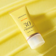 MENOKIN Glow & Clear Gel Sunscreen SPF50+ PA++++ 50ml golden sunscreen bottle on a light background