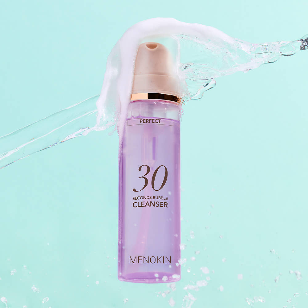 ProtoClinical k-beauty plum beauty product packaging centered on a soft aqua background.