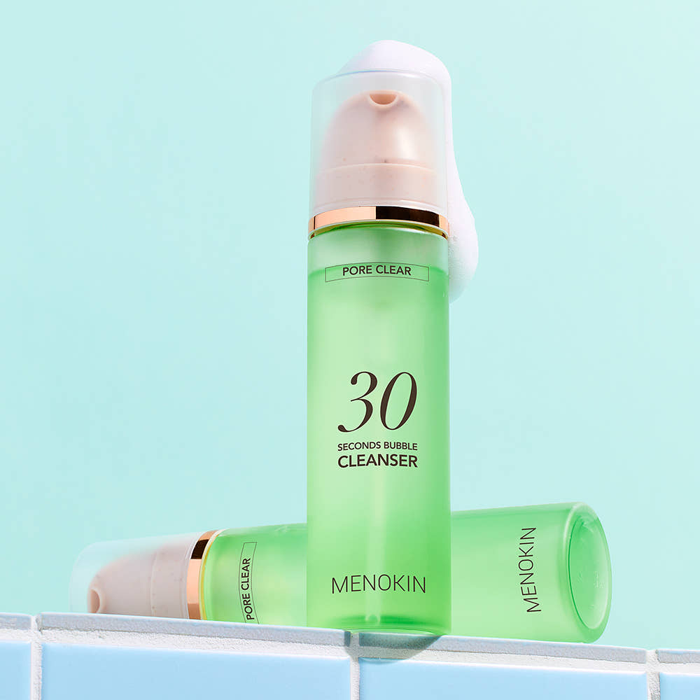 ProtoClinical k-beauty green beauty product with a darker center and pale blue side accents on a light background.