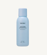 ProtoClinical k-beauty TONYMOLY Azulene Anti Blemish Lotion 200ml single upright pale blue lotion bottle centered on a soft white and peach background.