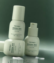 ProtoClinical k-beauty TONYMOLY Green Tea Moisturizing Serum 50ml single upright light green serum bottle centered on a soft white and blush background.