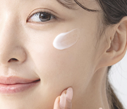 ProtoClinical k-beauty beige and brown skincare containers on a light background.