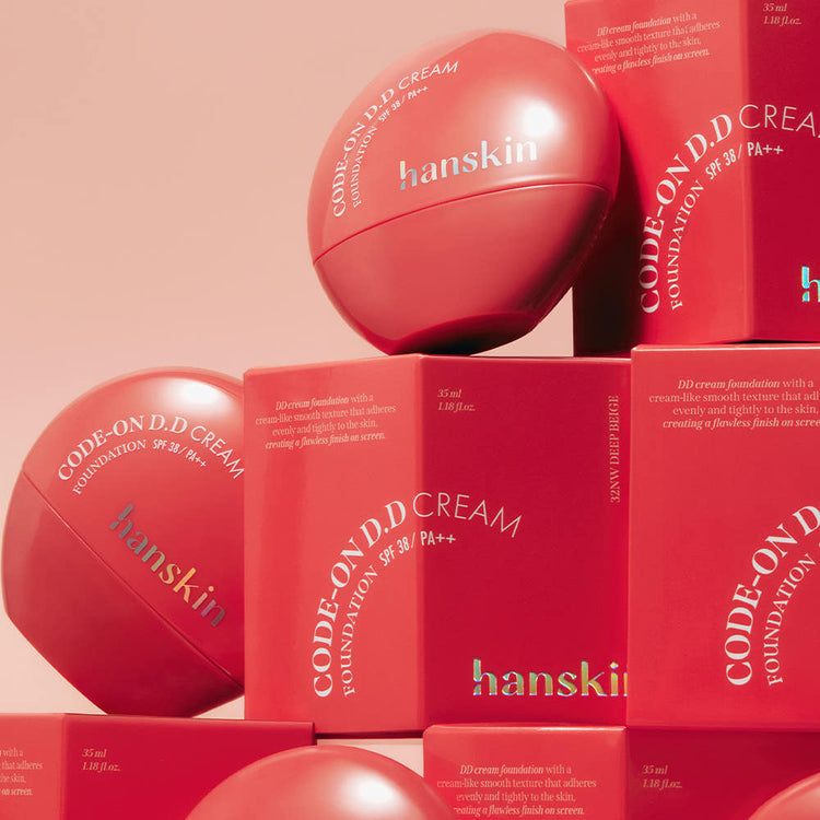 ProtoClinical k-beauty rose and red skincare bottle silhouette with a darker base on a pale pink background.