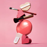 ProtoClinical k-beauty soft pink skincare packaging silhouette with two vertical forms on a pale pink background.