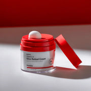 ProtoClinical k-beauty Hanskin Vitamin A Glow Retinol Cream 50ml in a single pink cream jar with a dark lid, shown close-up on a dusty rose background