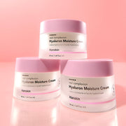 ProtoClinical k-beauty Hanskin Real Complexion Hyaluron Moisture Cream 50ml with a light-toned cream jar and matching box on a soft pink background