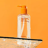 ProtoClinical k-beauty Hanskin Blackhead Water to Foam Cleansing 250ml tall teal cleansing bottle centered on a soft pink background