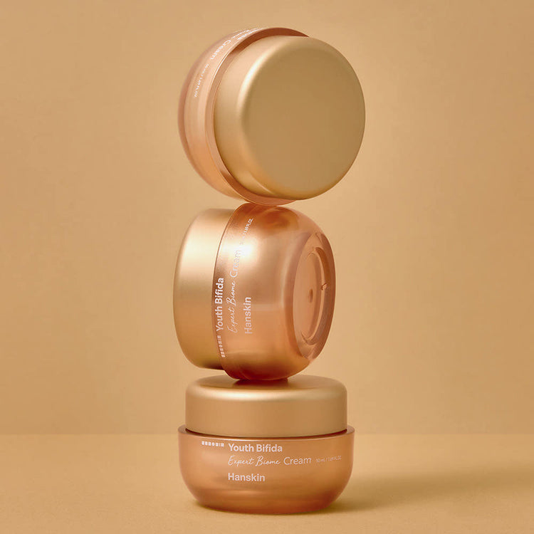 ProtoClinical k-beauty Hanskin Youth Bifida Expert Biome Cream 50ml single gold cream jar with a matching lid centered on a light background