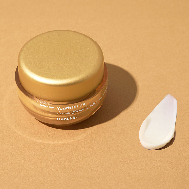ProtoClinical k-beauty Hanskin Youth Bifida Expert Biome Cream 50ml single gold cream jar with a matching lid centered on a light background