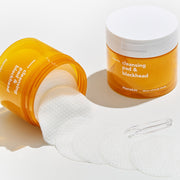 ProtoClinical k-beauty Hanskin Cleansing Pad & Blackhead 200ml/70ea open amber cleansing pad jar tipped sideways with textured white pads spilling forward beside a second upright jar