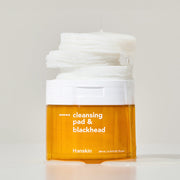ProtoClinical k-beauty Hanskin Cleansing Pad & Blackhead 200ml/70ea amber cleansing pad jar with a white lid topped by stacked white pads on a pale background
