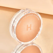 ProtoClinical k-beauty Hanskin Nudi Thin Cover Cushion SPF50+ PA+++ 12g (2colors) beige cushion packaging centered on a pale cream background with layered rectangular shapes