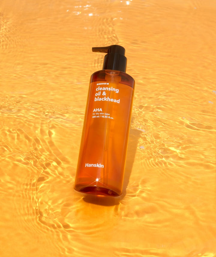 ProtoClinical k-beauty single upright orange package with a tall narrow silhouette centered on a golden yellow background.