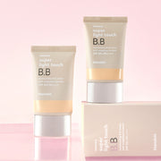 ProtoClinical k-beauty two muted mauve beauty bottles on a pale blush background.